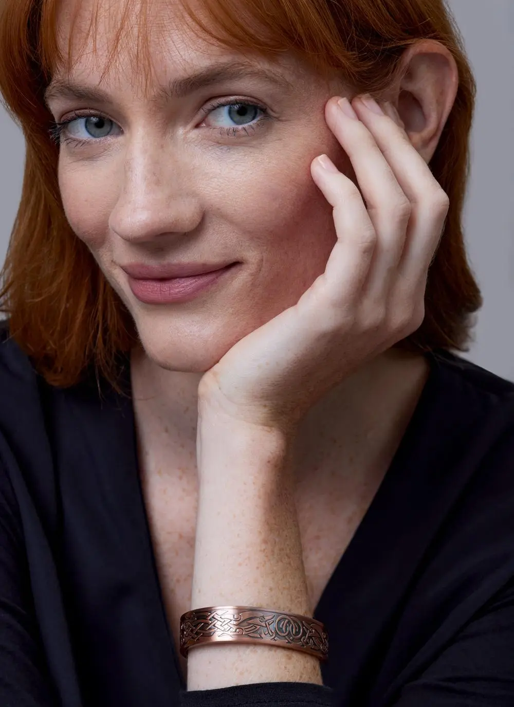 Red haired model wearing Pewter 